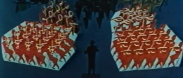 Animated frame from The Symphony Orchestra, 1956: the conductor stands at the center, the orchestra arranged around him as blocks of stylized red figures on blue.
