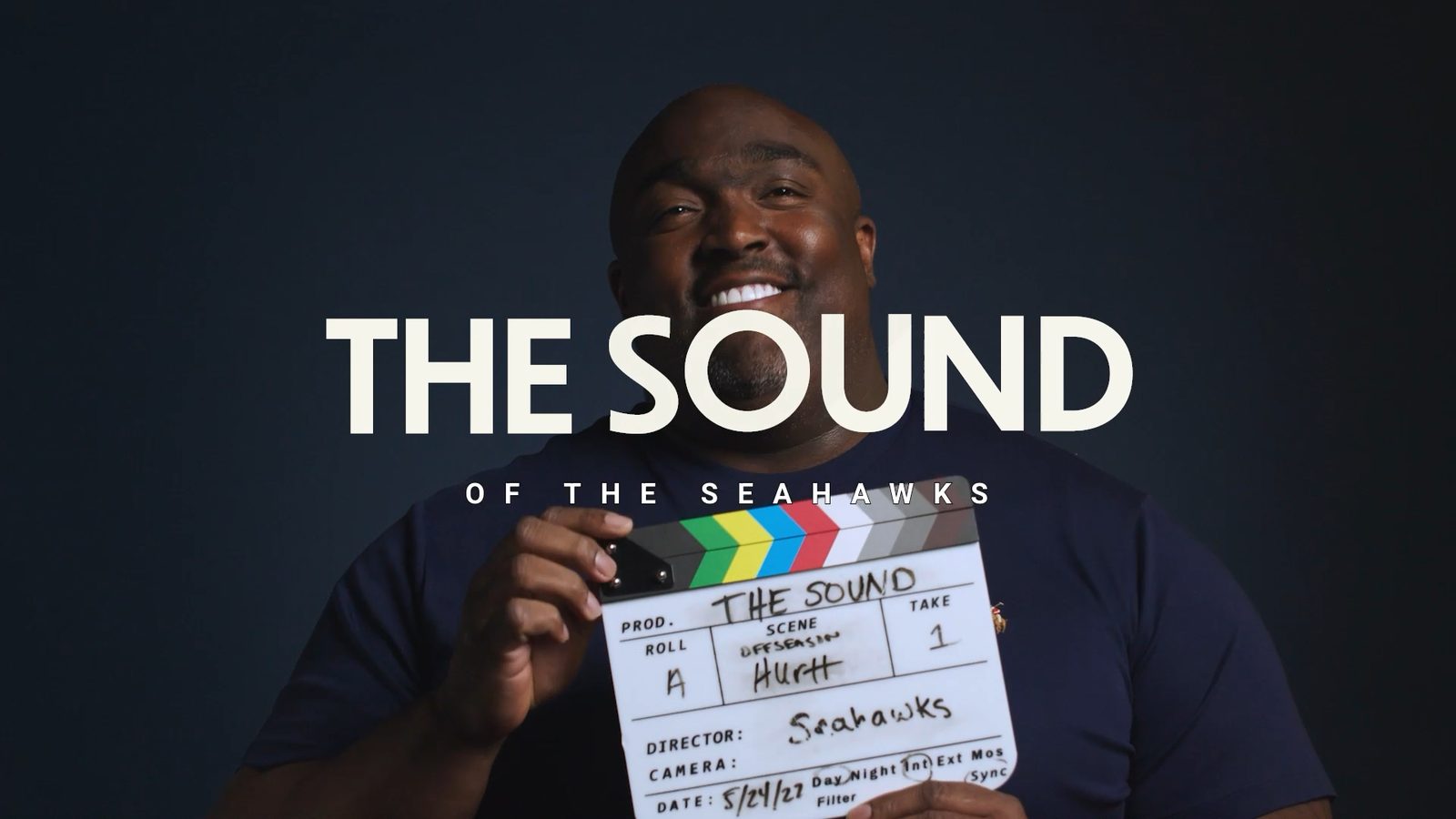 Title card from The Sound, season one: the series title over a man holding a hand-lettered film slate.